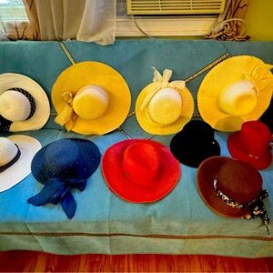 Many hats. From Europe and Canada and USA.  Show me which one you like best